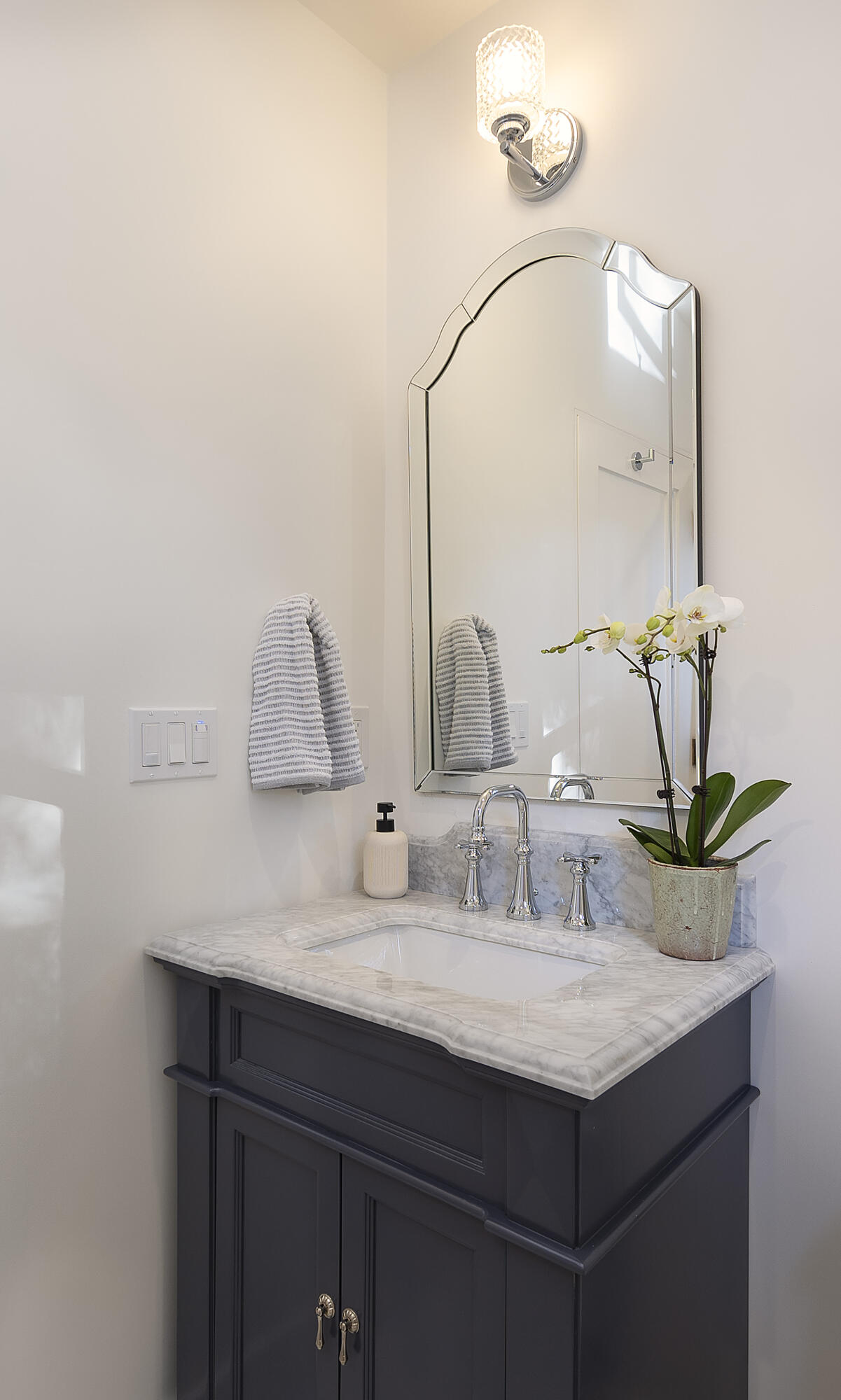 909 Chelham Way Montecito, CA 93108 - Photo 22 of 28 a bathroom with a sink and a mirror
