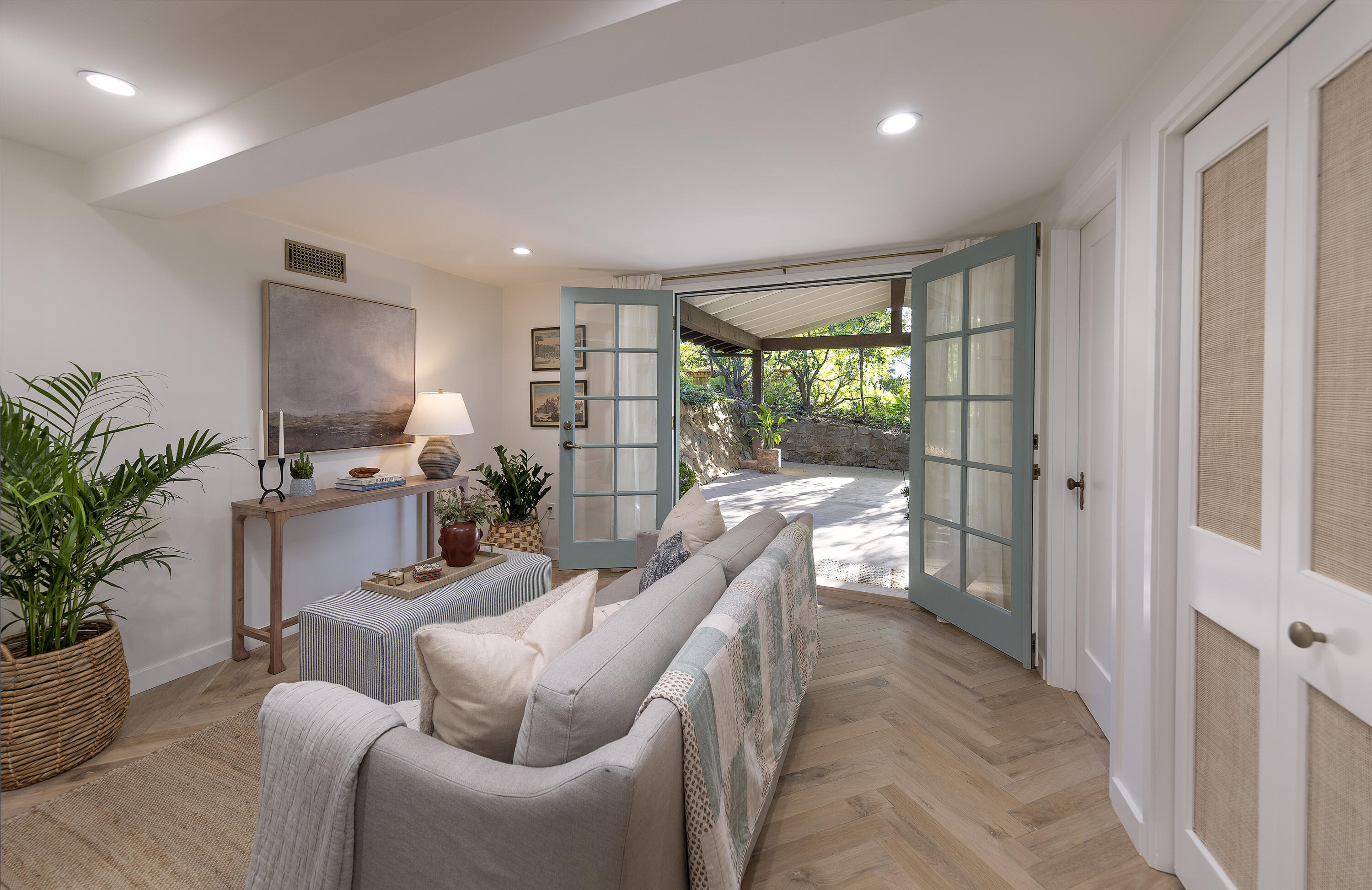 909 Chelham Way Montecito, CA 93108 - Photo 23 of 28 a living room with furniture potted plant and a large window