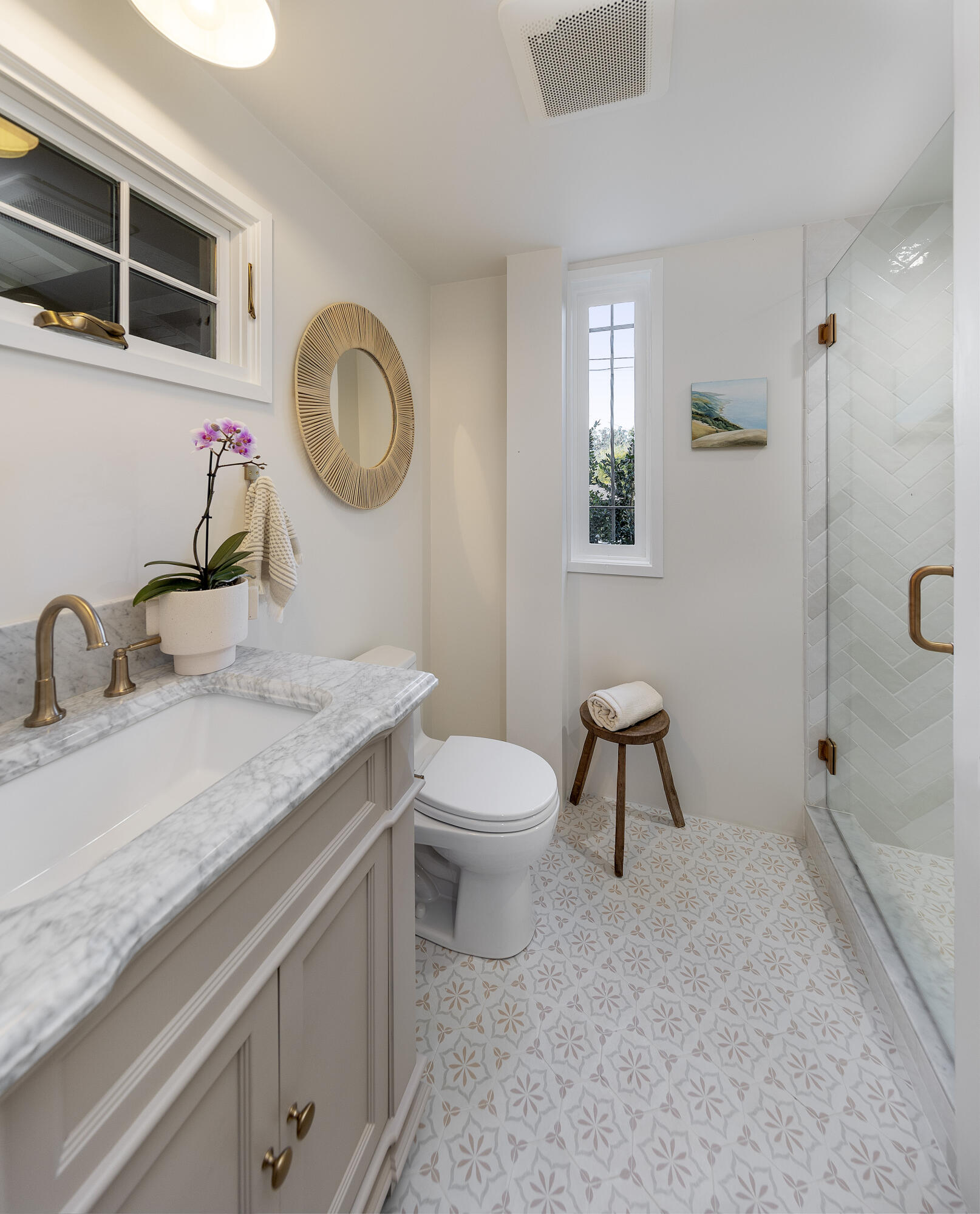 909 Chelham Way Montecito, CA 93108 - Photo 25 of 28 a bathroom with a granite countertop sink a toilet and a mirror