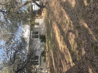 7371 Miller Creek Loop Johnson City, TX 78636 - Photo 2 of 37 a view of a house with a yard