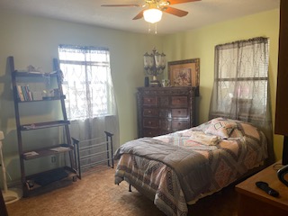 7371 Miller Creek Loop Johnson City, TX 78636 - Photo 33 of 37 a bedroom with a bed and a window