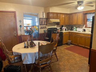 7371 Miller Creek Loop Johnson City, TX 78636 - Photo 37 of 37 a kitchen with a table chairs sink and cabinets