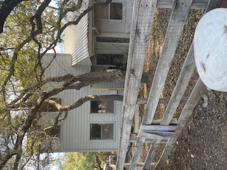 7371 Miller Creek Loop Johnson City, TX 78636 - Photo 5 of 37 a view of a house with a tree