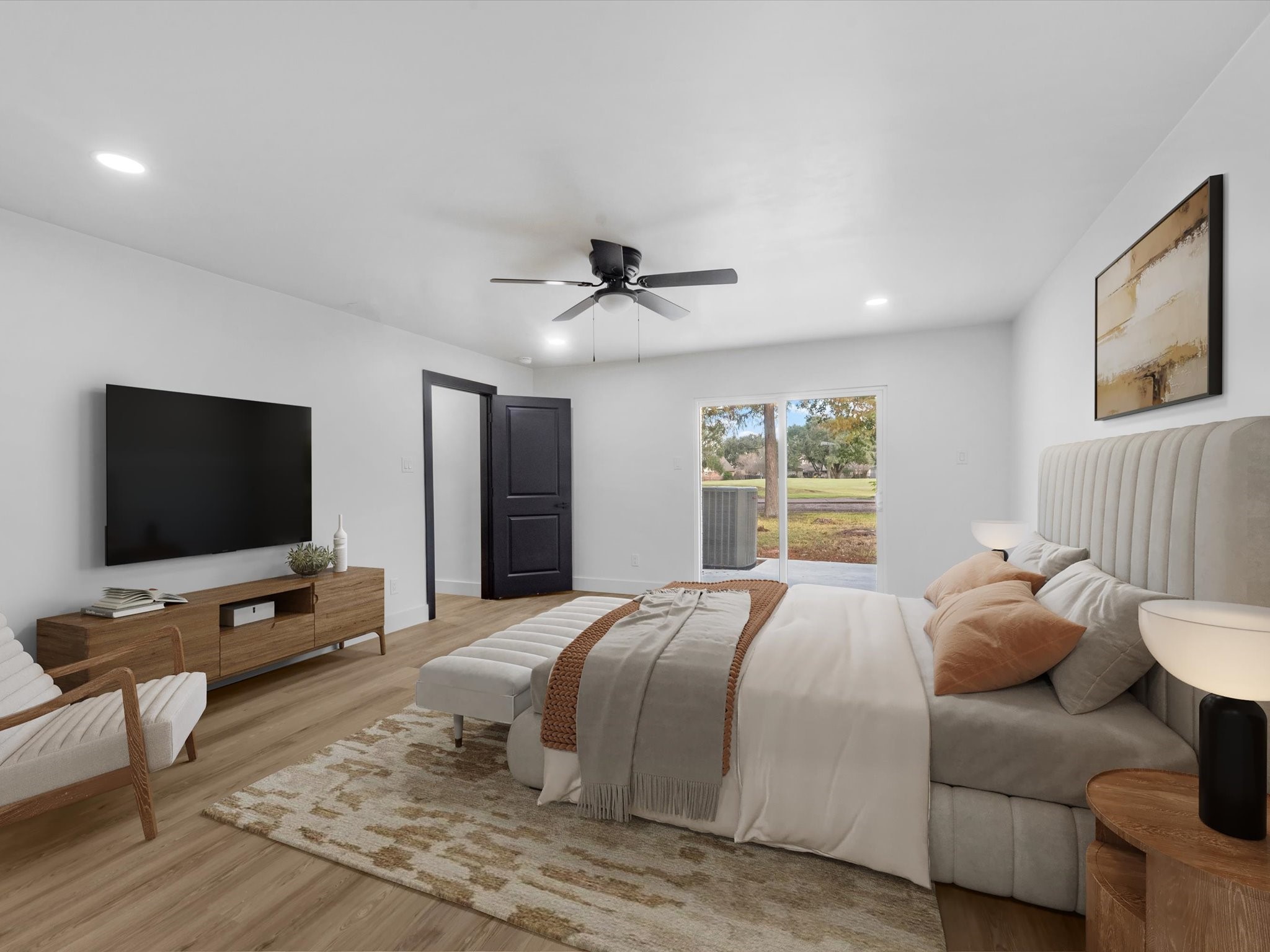 3514 La Costa Road Missouri City, TX 77459 - Photo 14 of 38 a bedroom with a bed and a flat screen tv