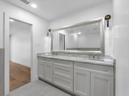 a bathroom with a bathtub and shower