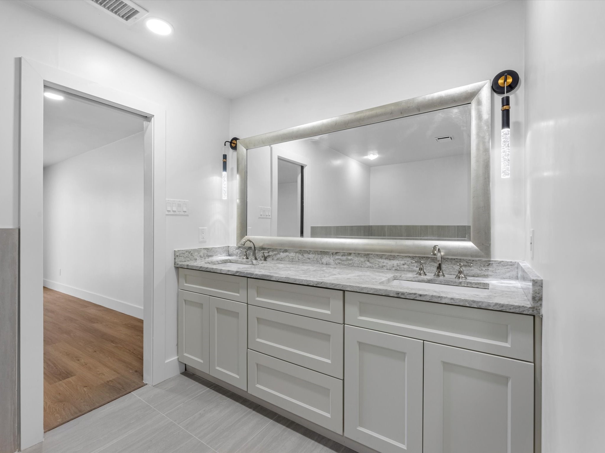 3514 La Costa Road Missouri City, TX 77459 - Photo 15 of 38 a bathroom with a granite countertop sink and a mirror