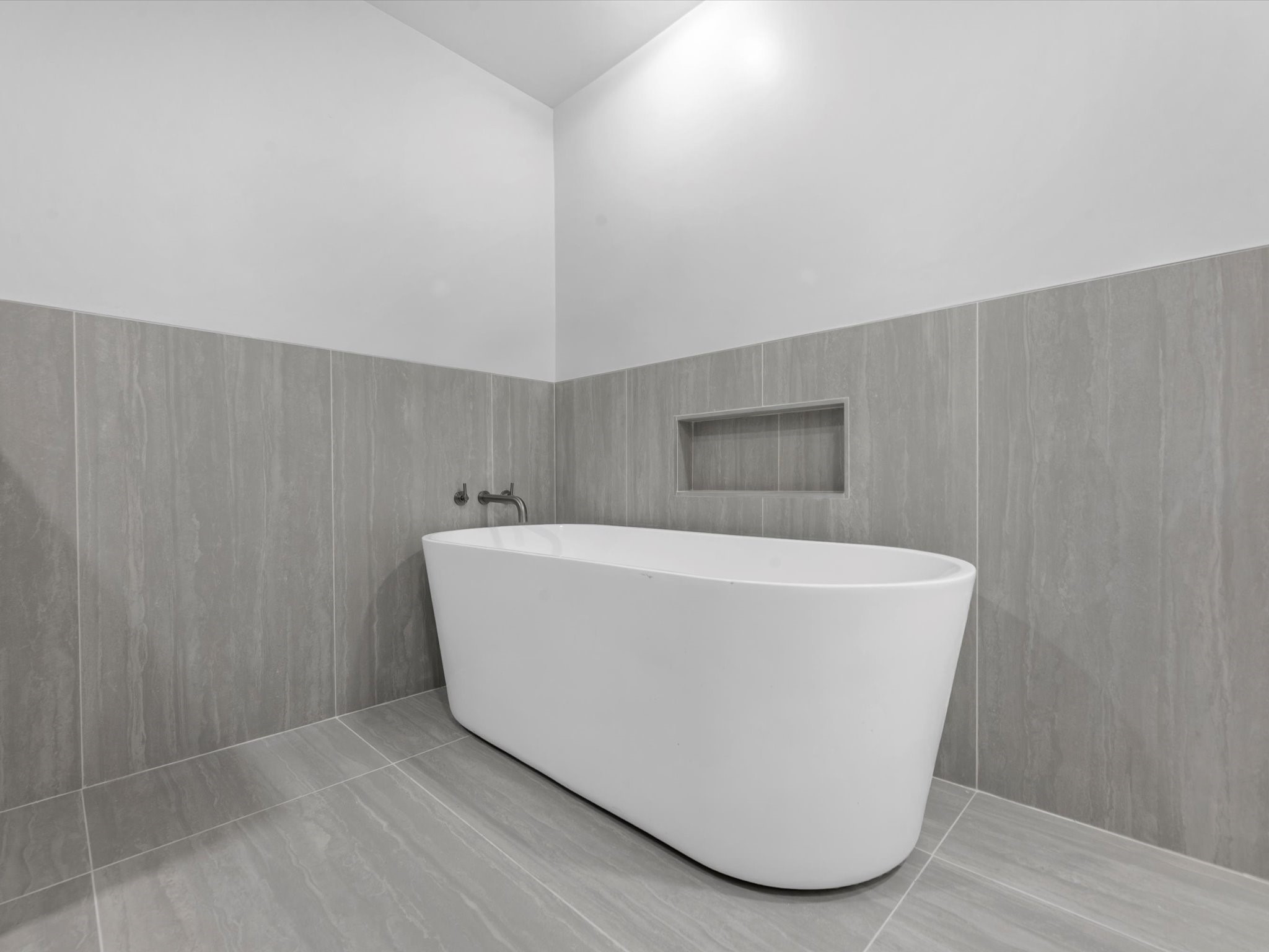 3514 La Costa Road Missouri City, TX 77459 - Photo 17 of 38 a white tub sitting in a bathroom