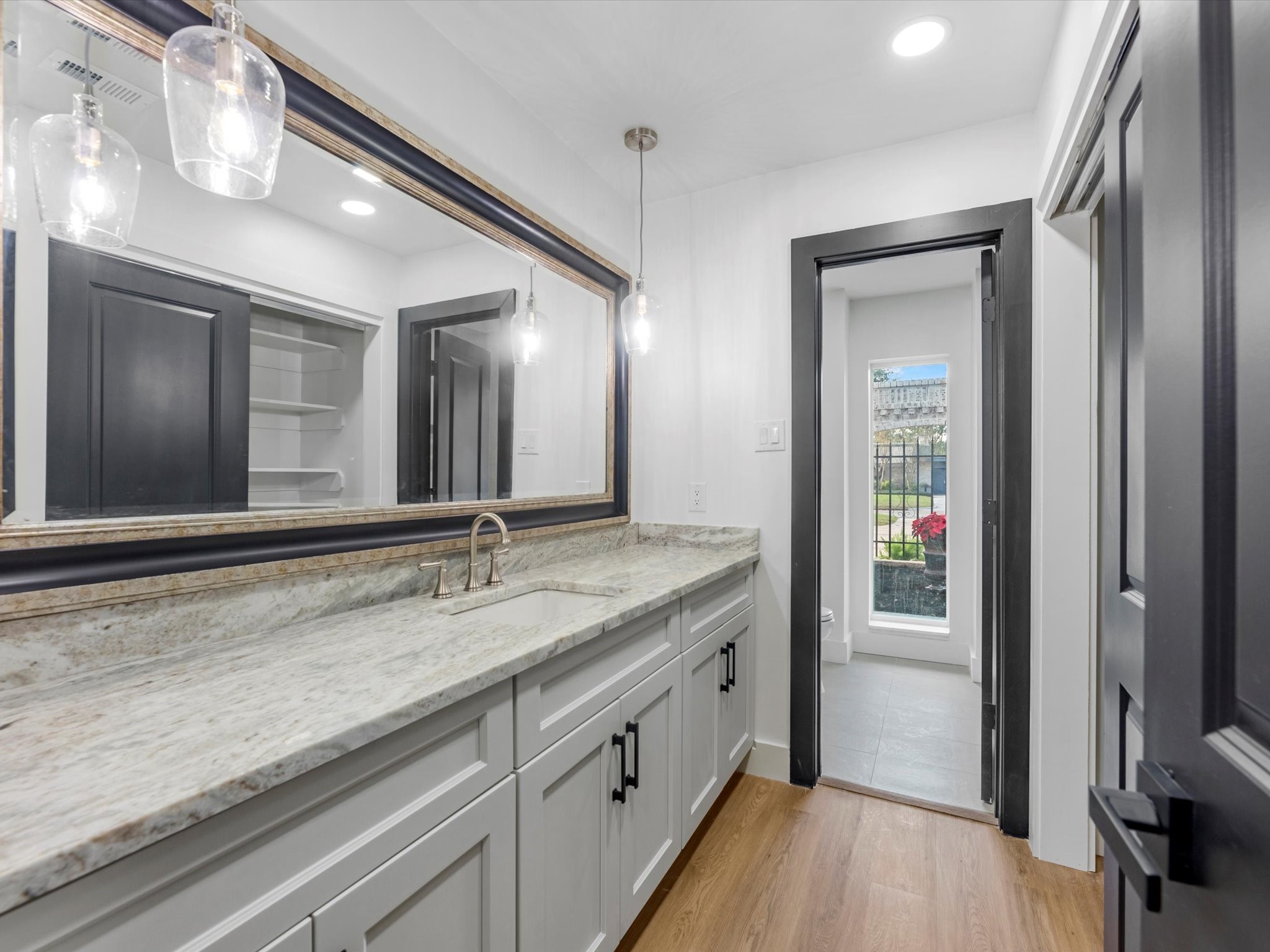 3514 La Costa Road Missouri City, TX 77459 - Photo 20 of 38 a spacious bathroom with a granite countertop sink and a mirror