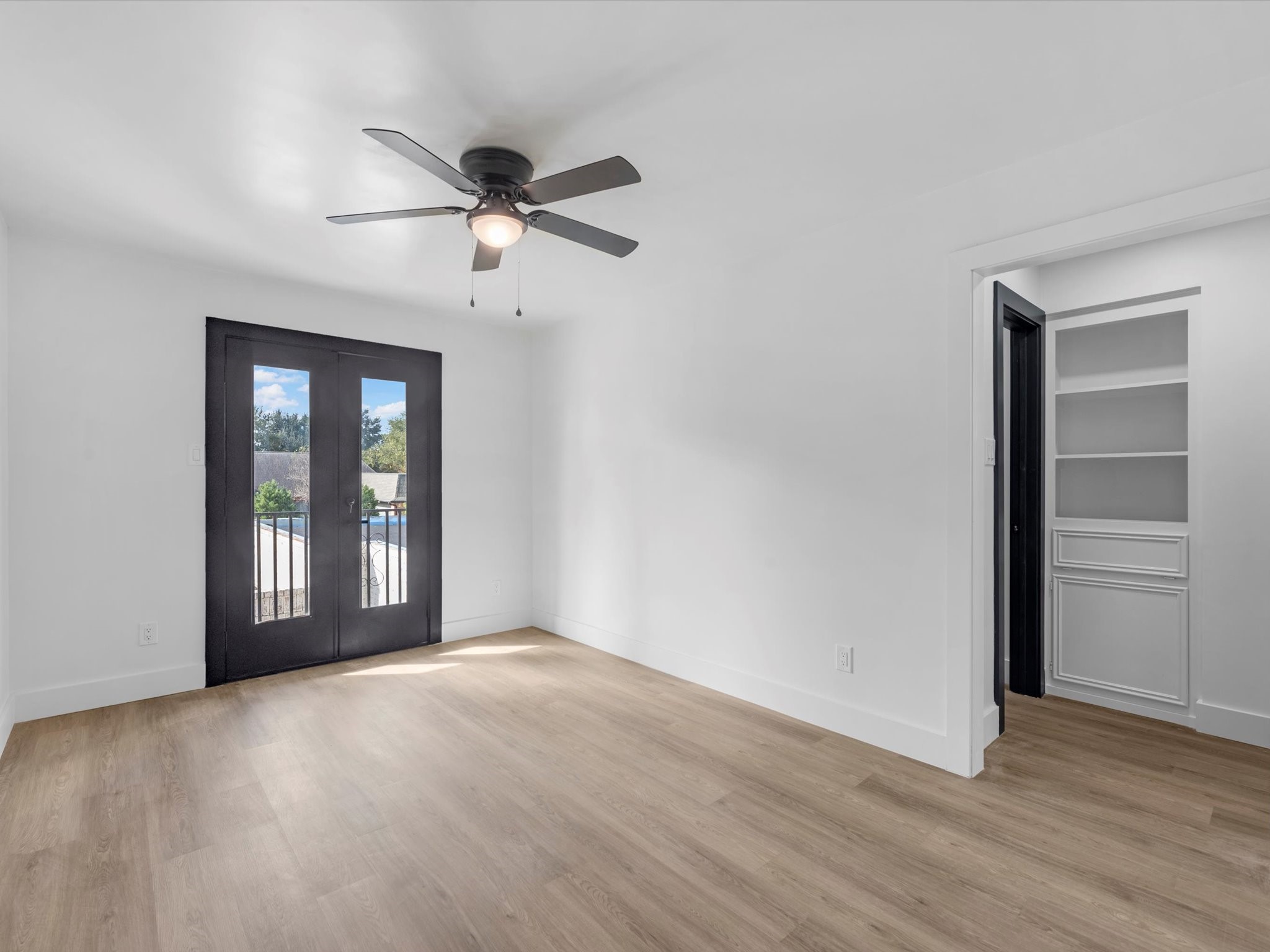 3514 La Costa Road Missouri City, TX 77459 - Photo 23 of 38 a view of an empty room with a window and wooden floor