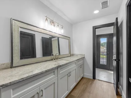 a view of gallery with wooden floor