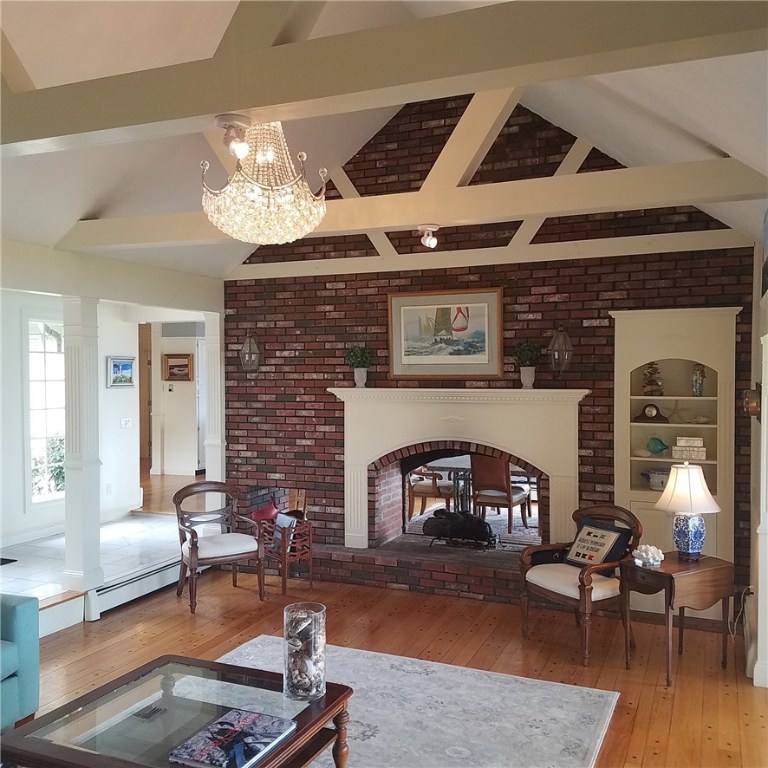 1046 East Shore Road Jamestown, RI 02835 - Photo 13 of 29 Vaulted living room with double sided fireplace