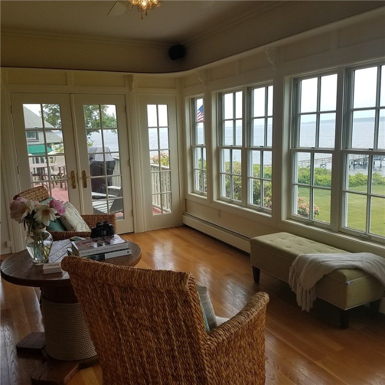 1046 East Shore Road Jamestown, RI 02835 - Photo 14 of 29 Sunroom with a different furniture setup to enjoy the views