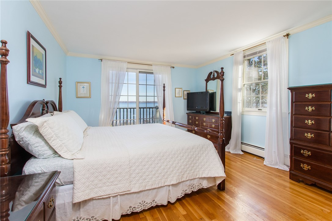 1046 East Shore Road Jamestown, RI 02835 - Photo 18 of 29 1st floor guest bedroom with private balcony overlooking the water