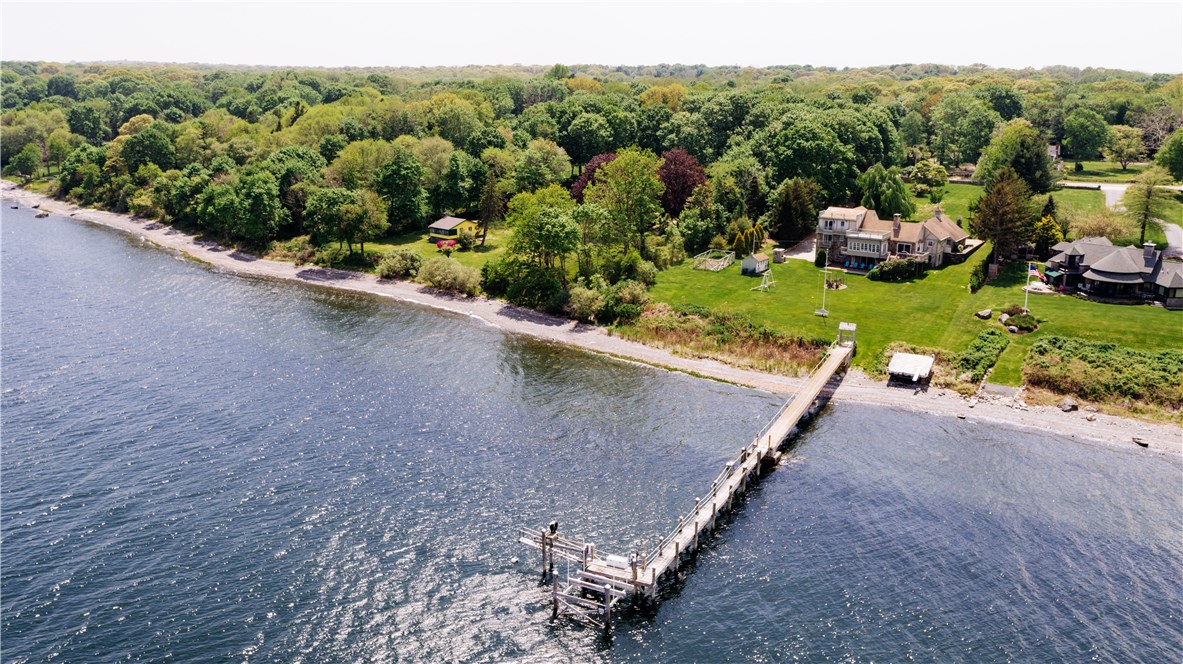 1046 East Shore Road Jamestown, RI 02835 - Photo 2 of 29 Aerial showing dock in the foreground, house behind