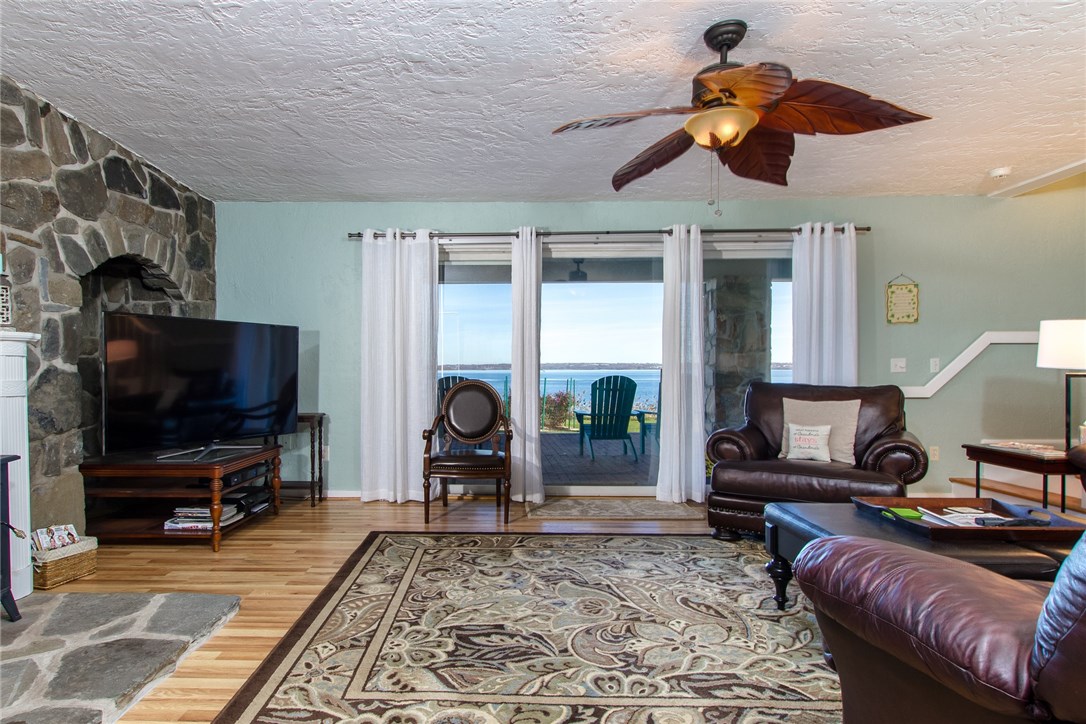 1046 East Shore Road Jamestown, RI 02835 - Photo 22 of 29 Lower level family room has sliders to the waterside patio