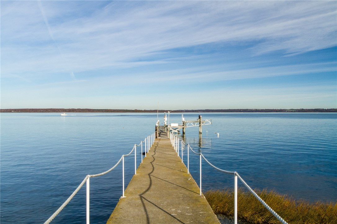 1046 East Shore Road Jamestown, RI 02835 - Photo 24 of 29 Deep water private dock, constructed of concrete and wood timber, also has a 15,000 lb boat lift