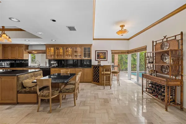 a kitchen with stainless steel appliances granite countertop a sink a stove and a refrigerator