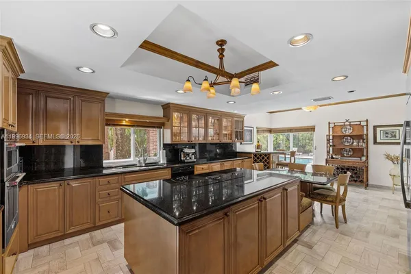 a kitchen with a sink and large window