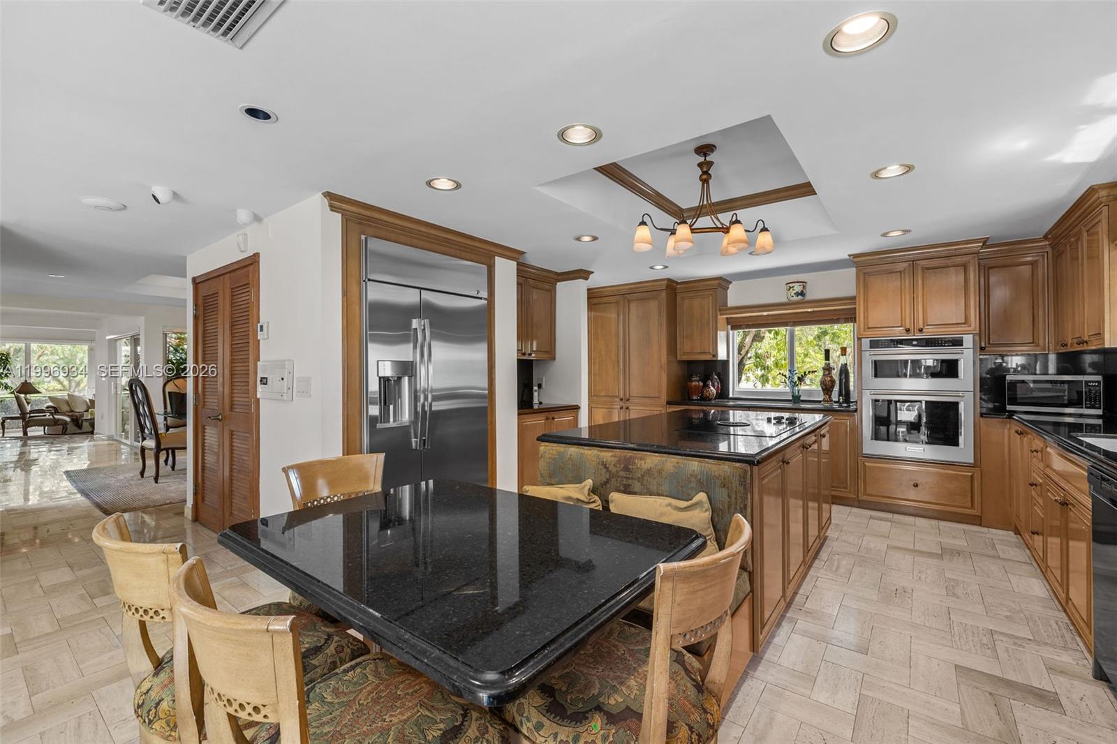 8450 Southwest 74th Terrace Miami, FL 33143 - Photo 15 of 54 a kitchen with stainless steel appliances granite countertop a sink a stove and a refrigerator
