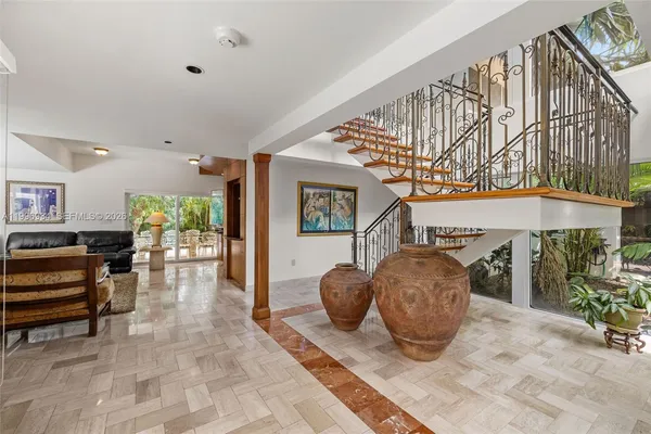 a view of a patio with a table and chairs