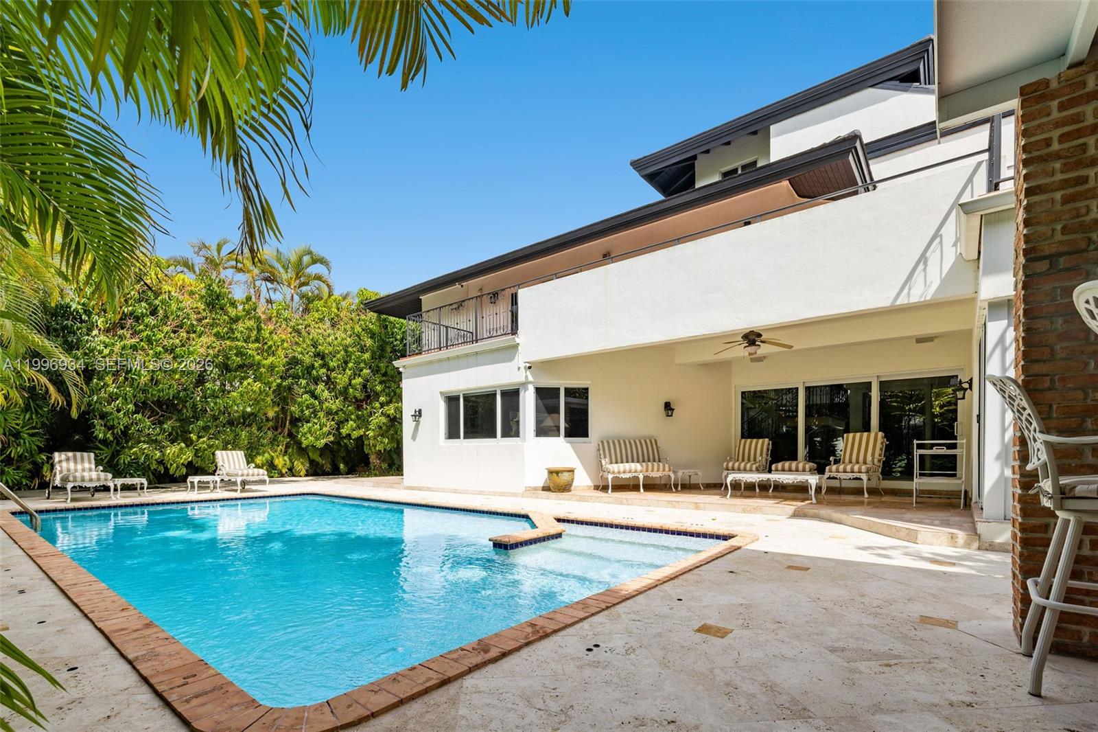 8450 Southwest 74th Terrace Miami, FL 33143 - Photo 22 of 54 a view of a patio with swimming pool table and chairs