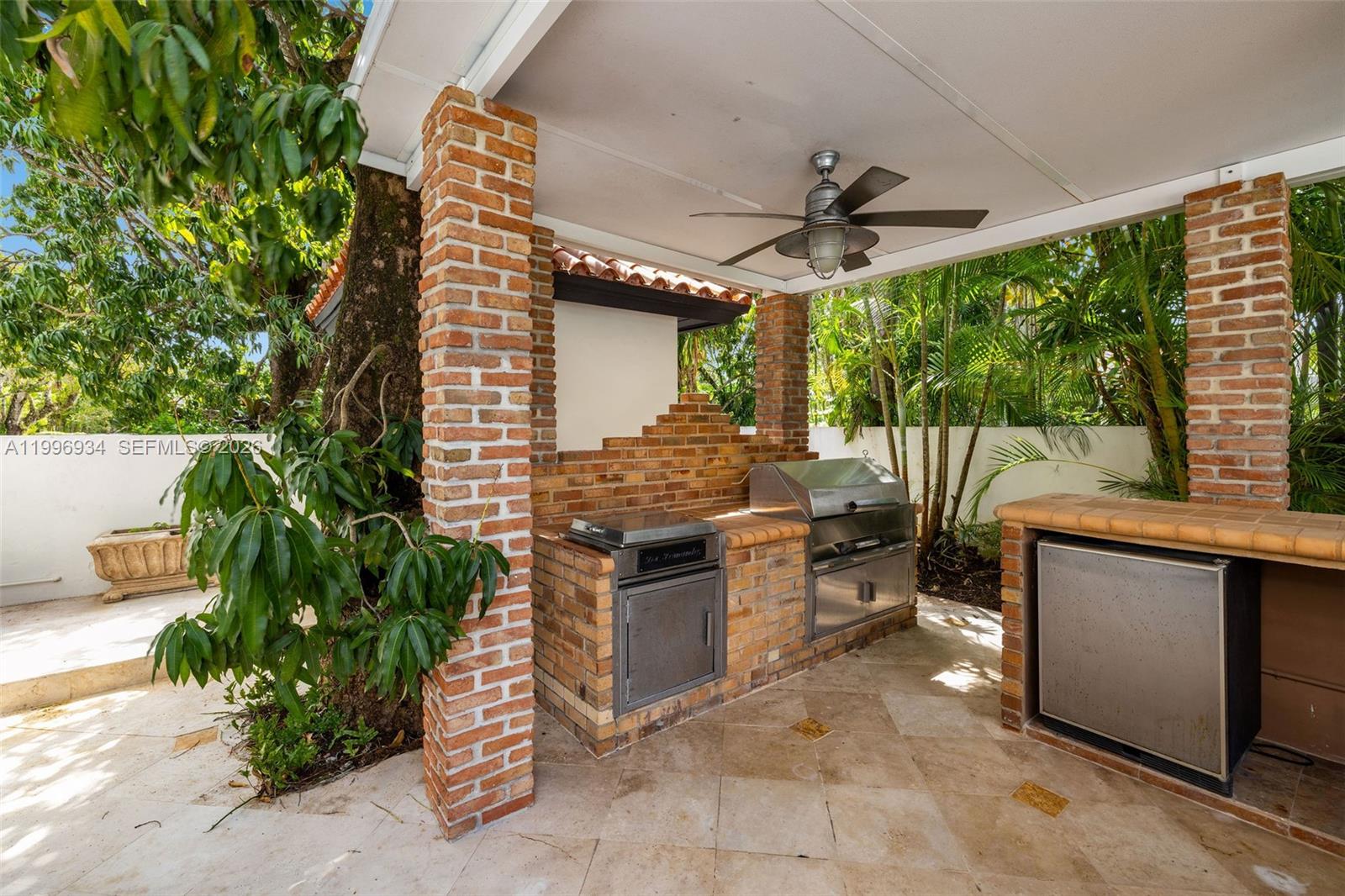 8450 Southwest 74th Terrace Miami, FL 33143 - Photo 25 of 54 a kitchen with a stove and a potted plant