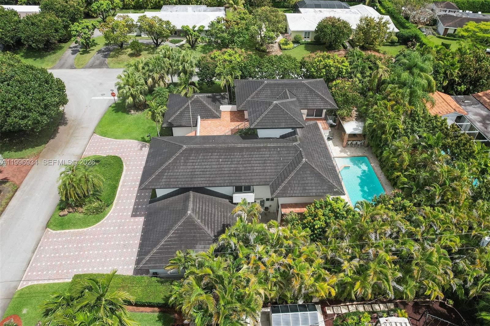 8450 Southwest 74th Terrace Miami, FL 33143 - Photo 3 of 54 an aerial view of a house with a yard and potted plants