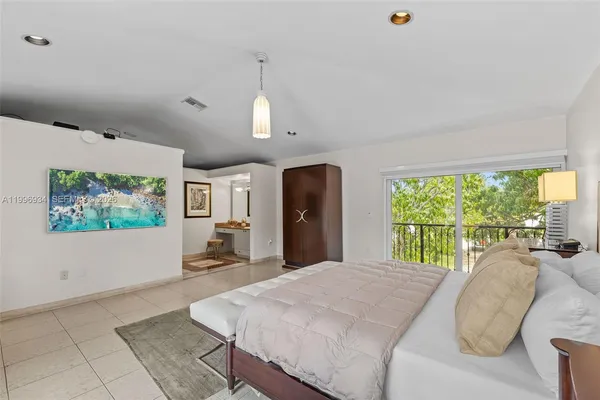 a view of a roof deck with wooden fence and plants