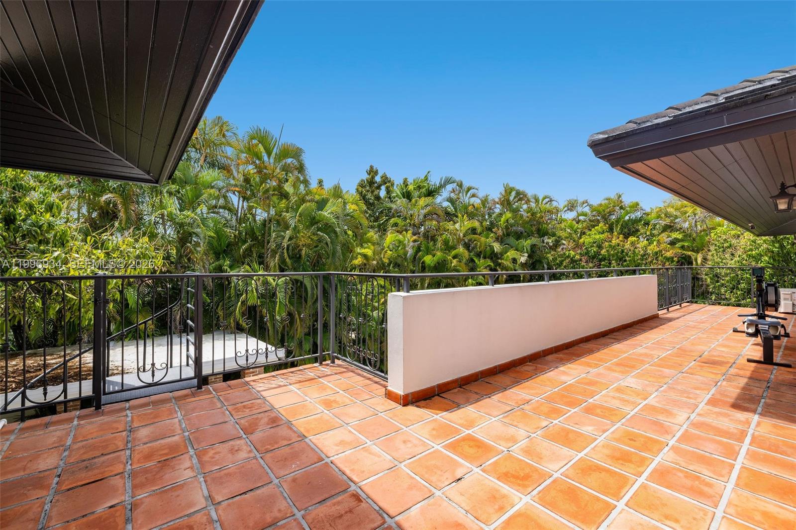 8450 Southwest 74th Terrace Miami, FL 33143 - Photo 35 of 54 a view of a roof deck with wooden fence and plants