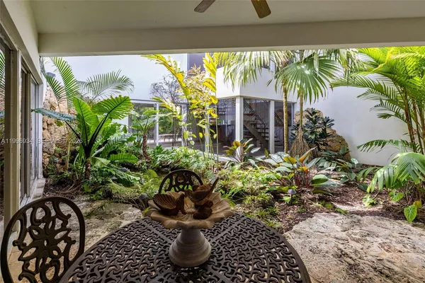 a bedroom with a bed and sliding window