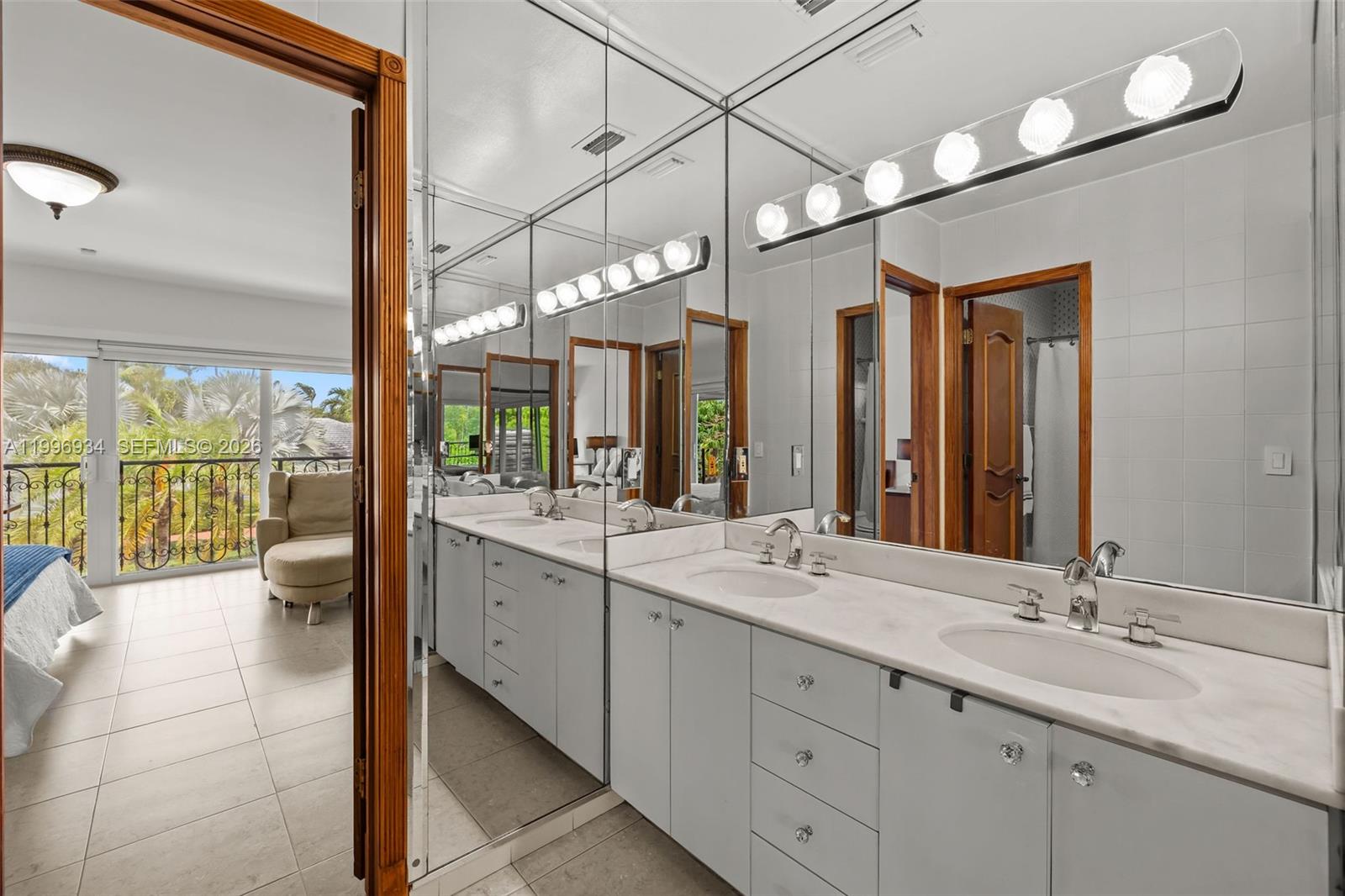 8450 Southwest 74th Terrace Miami, FL 33143 - Photo 43 of 54 a spacious bathroom with a double vanity sink and a mirror