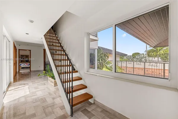 a spacious bathroom with a shower sink and mirror