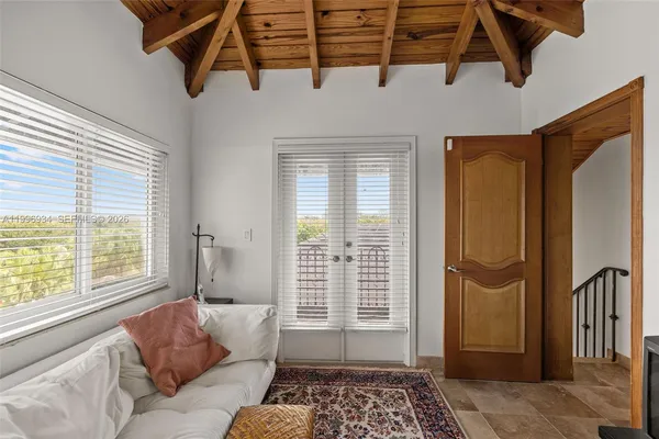a kitchen with stainless steel appliances granite countertop a sink and a white cabinets