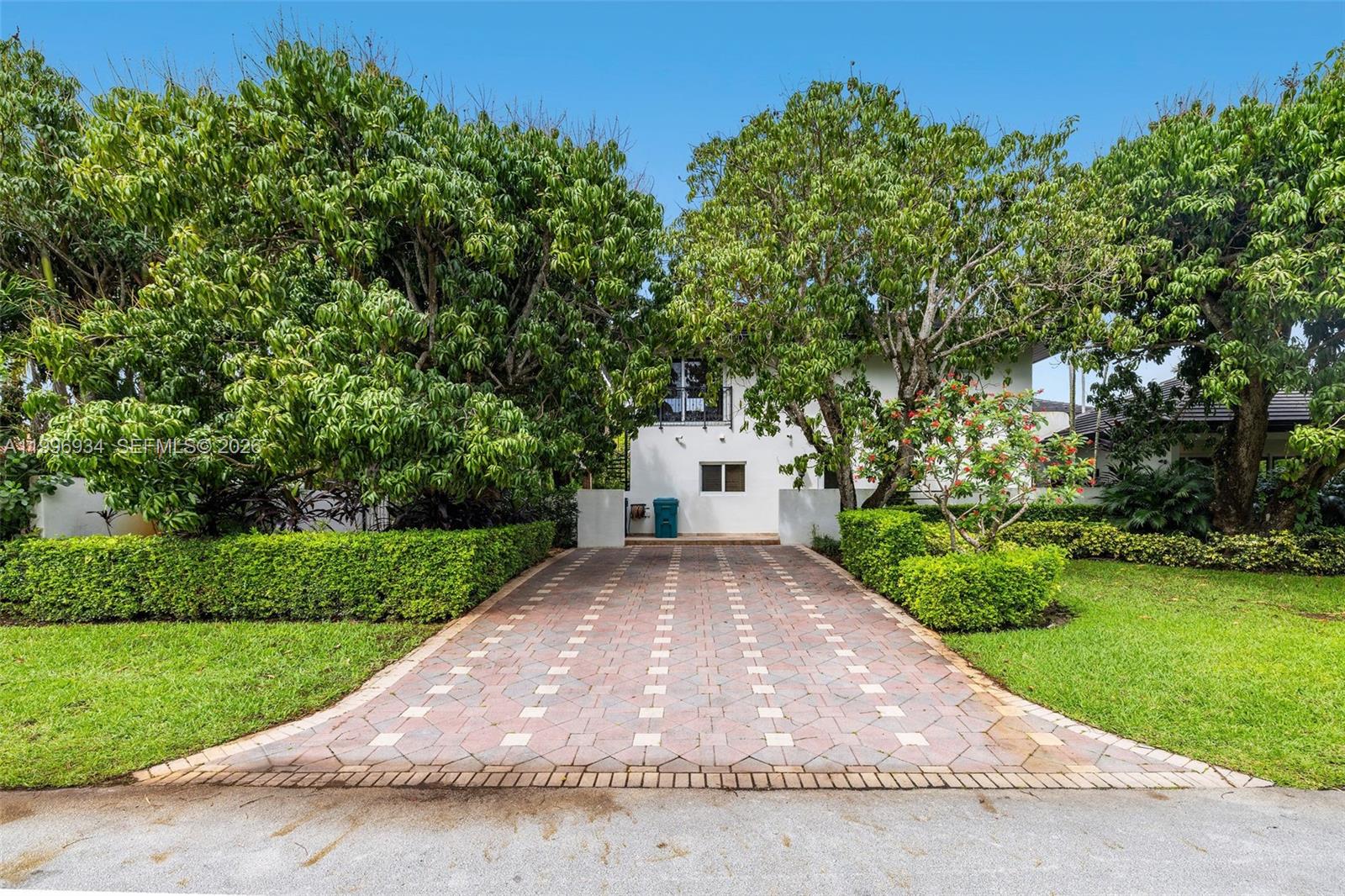 8450 Southwest 74th Terrace Miami, FL 33143 - Photo 54 of 54 a view of a yard with plants and large trees