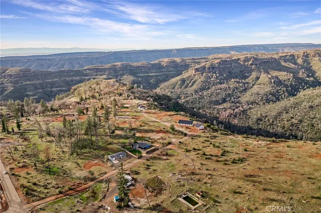 an aerial view of residential building with trees
