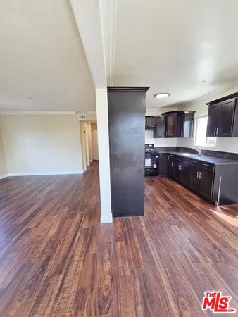 a view of kitchen and wooden floor