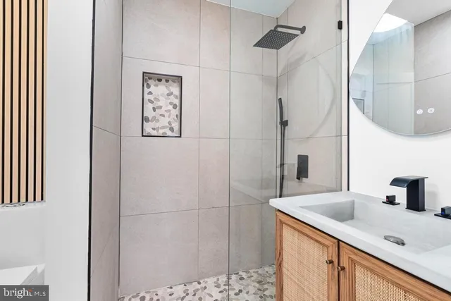 a bathroom with a sink and mirror