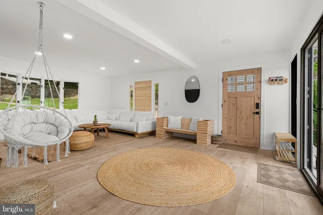 a living room with furniture and a table