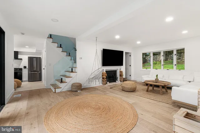 a bedroom with furniture and a flat screen tv