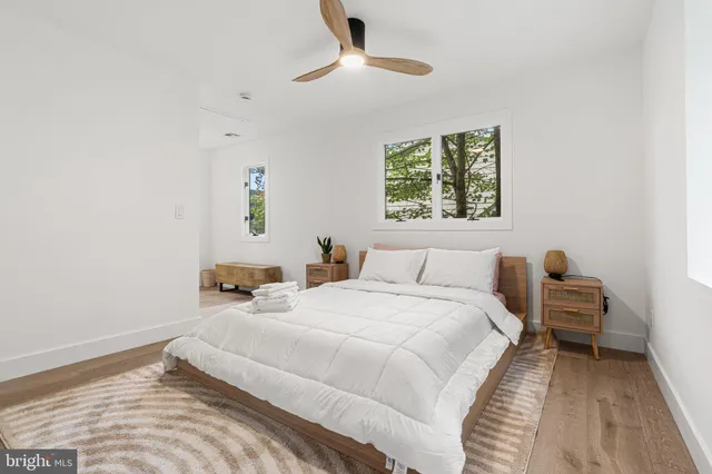 a bedroom with bed and a window