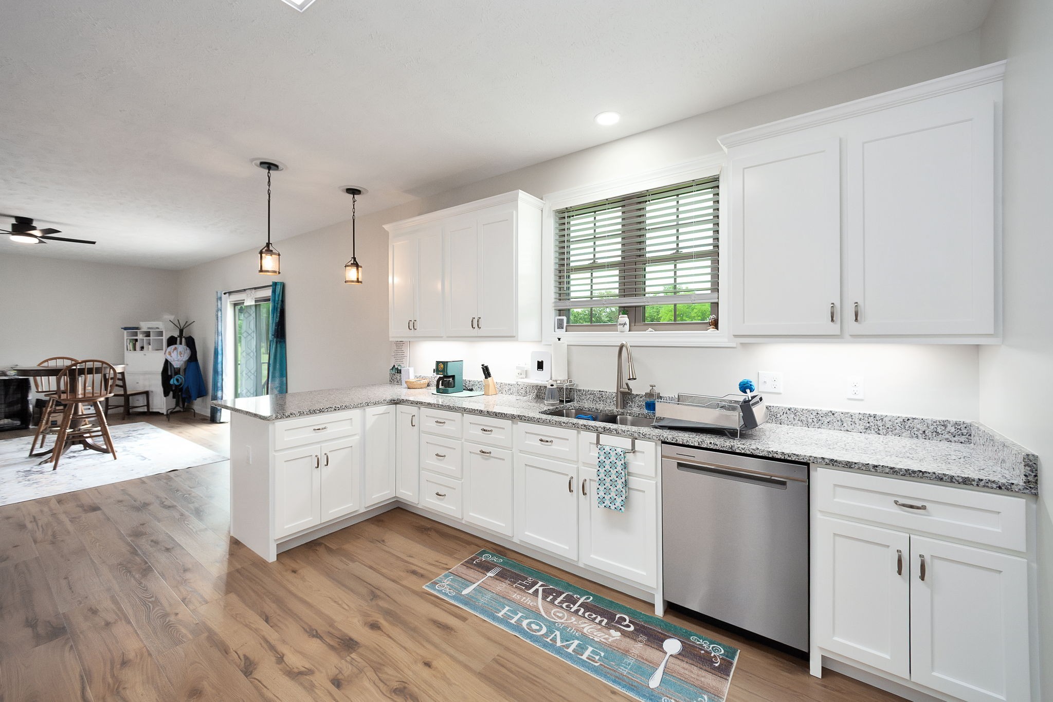 745 Alman Cemetery Road Paris, TN 38242 - Photo 10 of 31 a kitchen with a sink window and cabinets