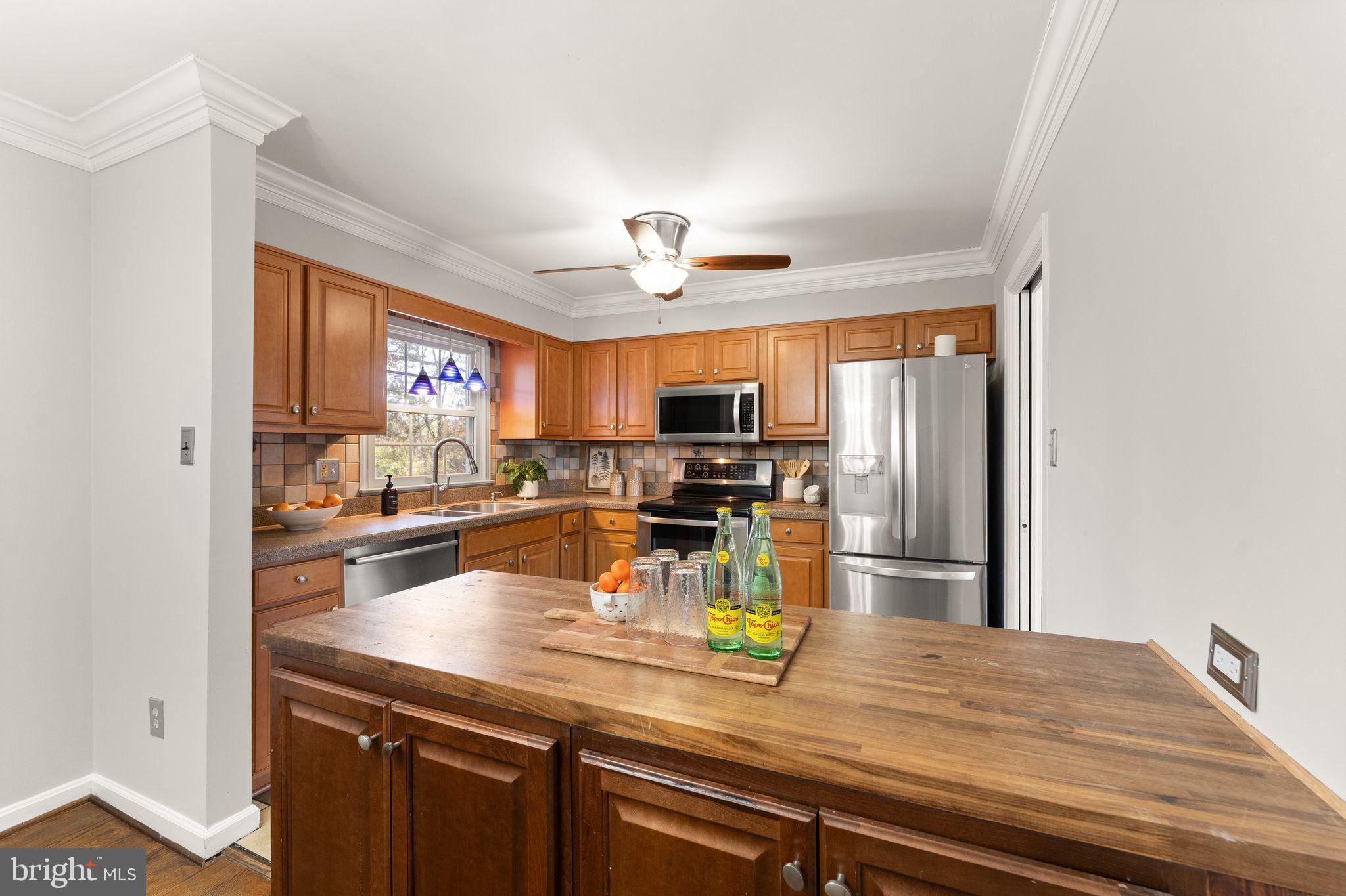 6101 Briarview Court Alexandria, VA 22310 - Photo 12 of 44 a kitchen with a sink appliances and cabinets