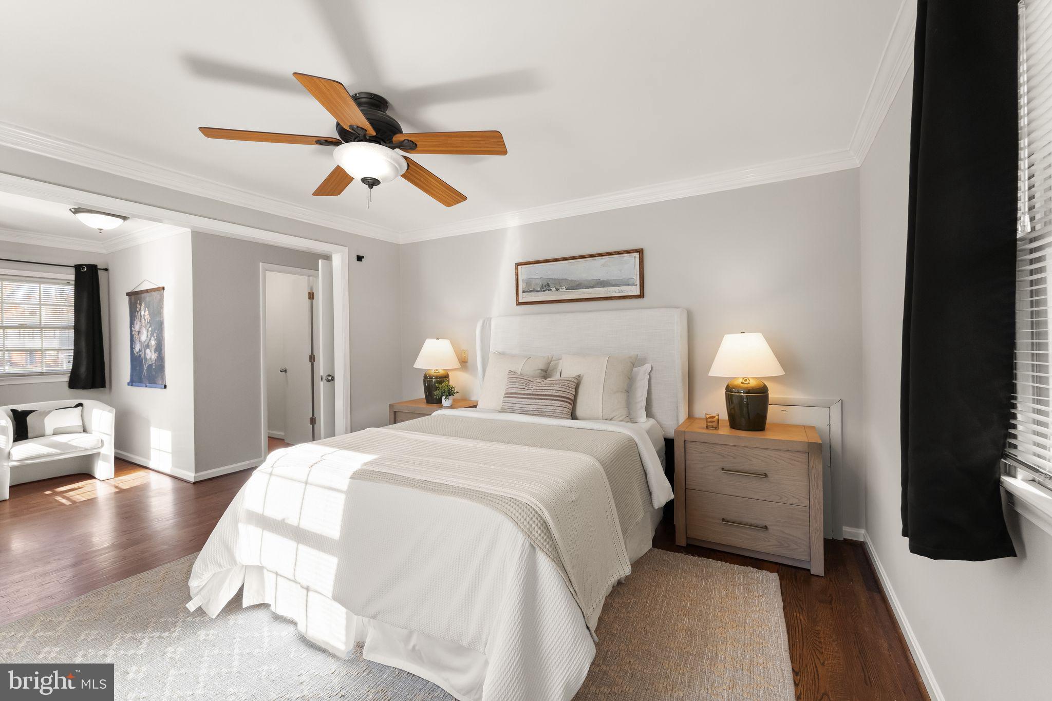 6101 Briarview Court Alexandria, VA 22310 - Photo 20 of 44 a bedroom with a bed and a chandelier