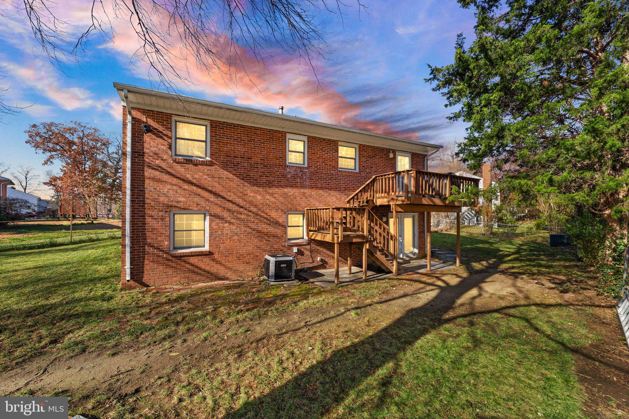 6101 Briarview Court Alexandria, VA 22310 - Photo 2 of 44 a view of a house with backyard and sitting area