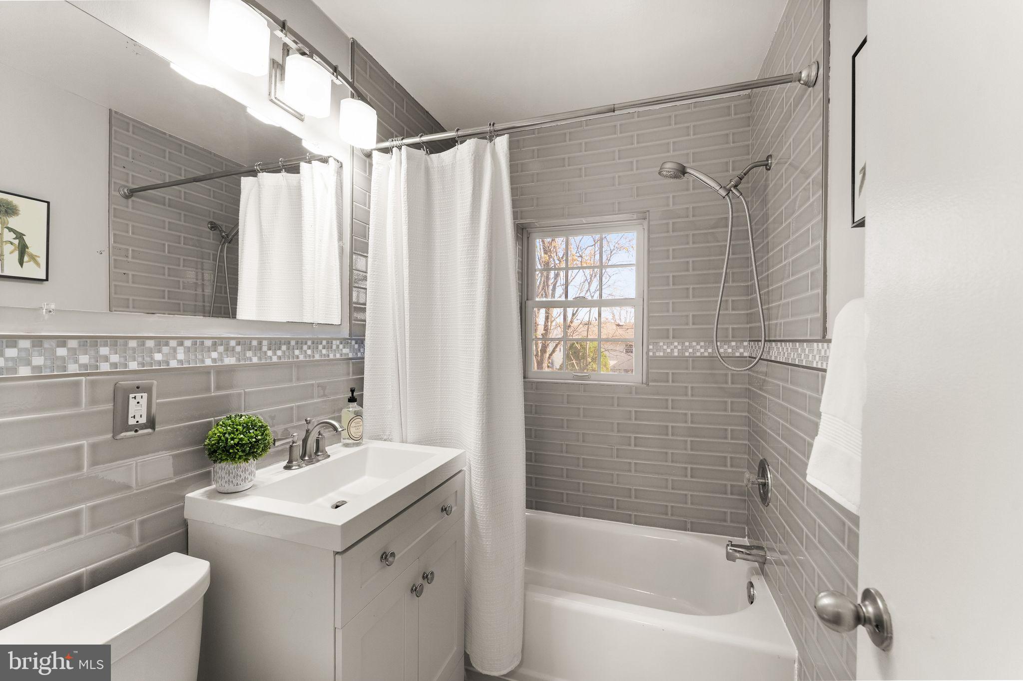 6101 Briarview Court Alexandria, VA 22310 - Photo 22 of 44 a bathroom with a sink and a mirror