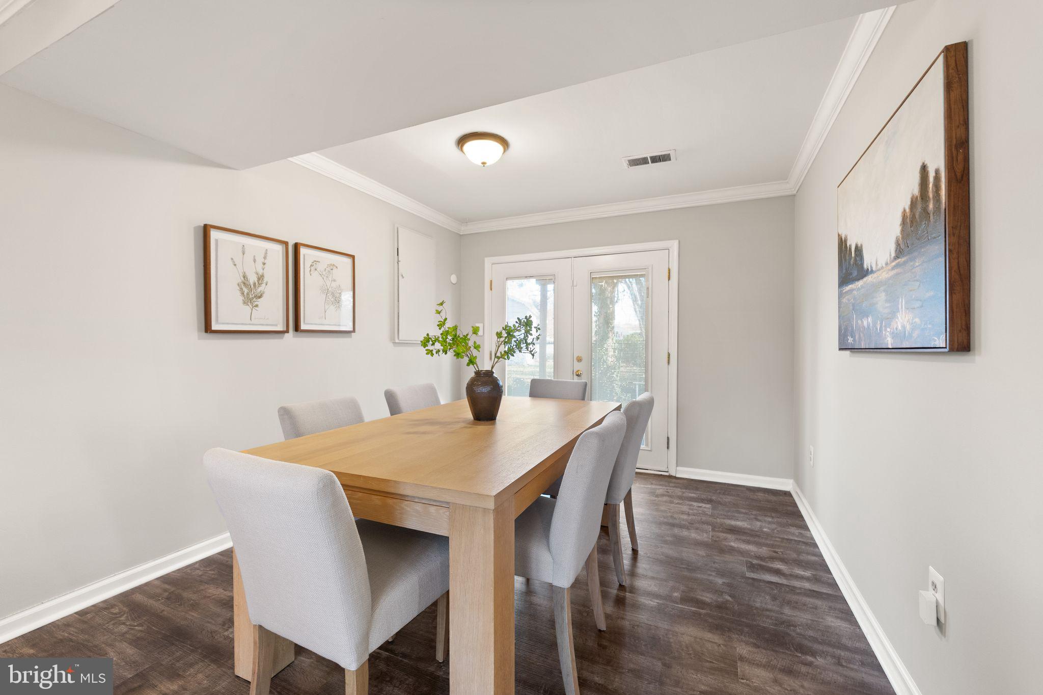 6101 Briarview Court Alexandria, VA 22310 - Photo 26 of 44 a view of a dining room with furniture and wooden floor