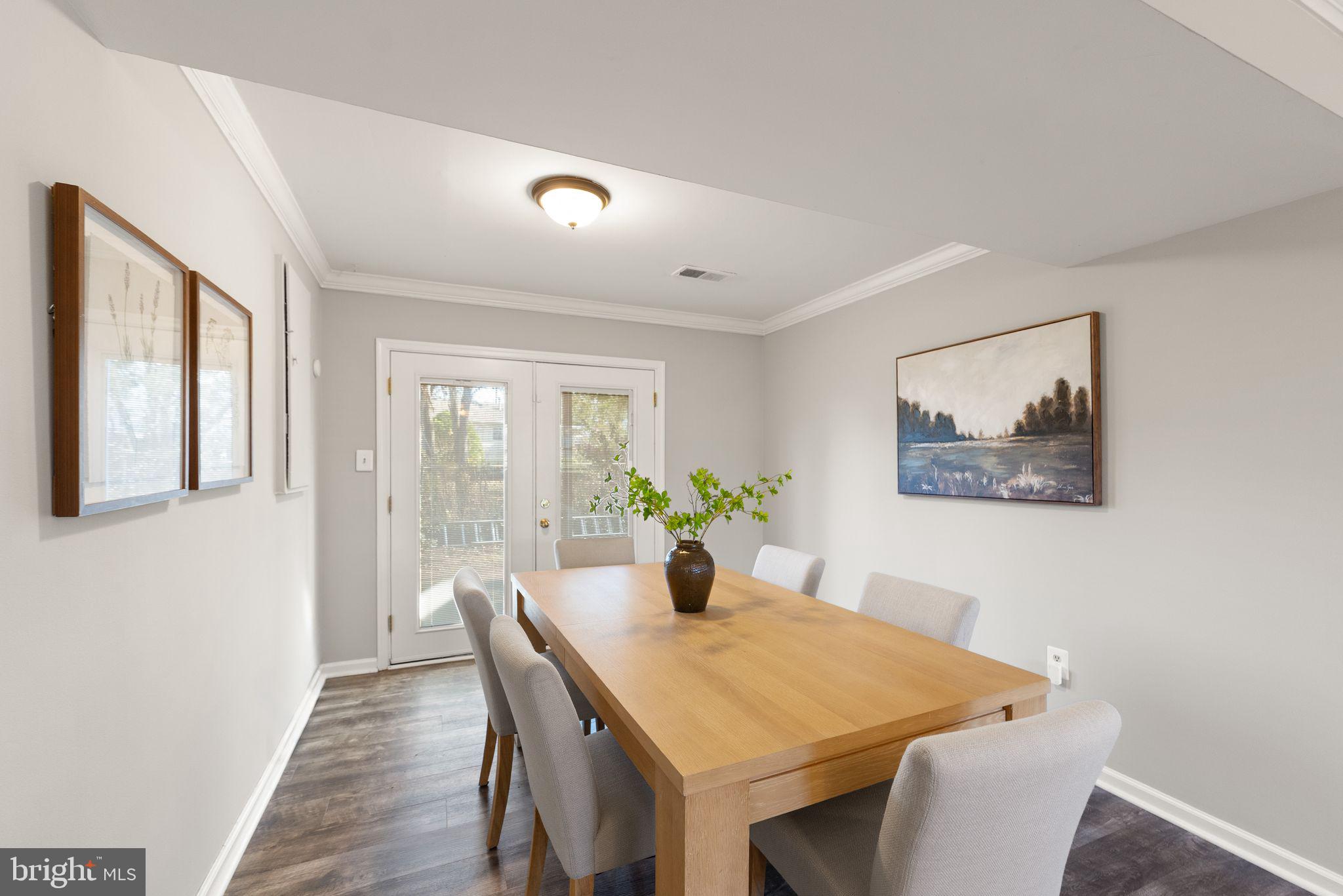 6101 Briarview Court Alexandria, VA 22310 - Photo 27 of 44 a view of a dining room with furniture and wooden floor