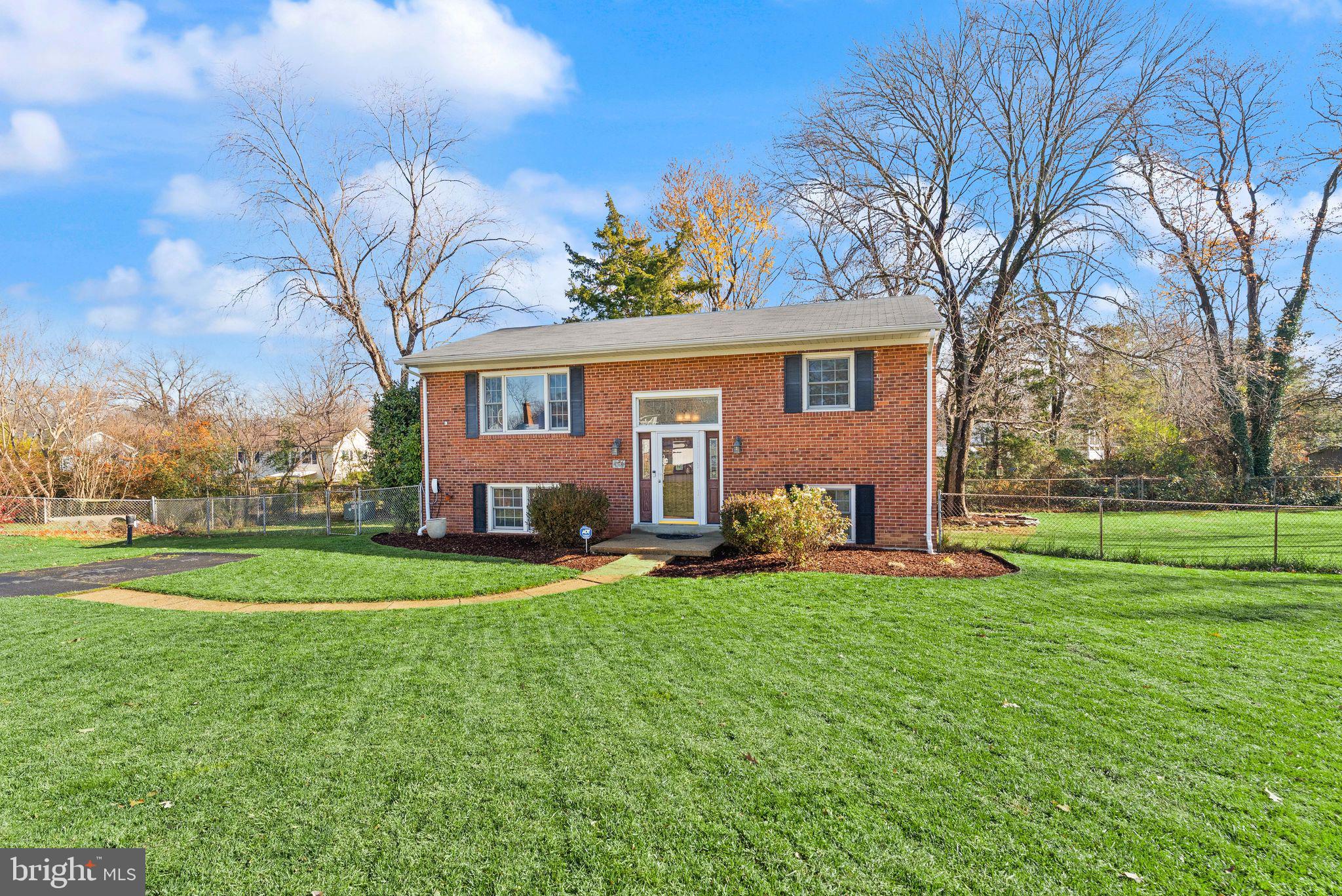 6101 Briarview Court Alexandria, VA 22310 - Photo 3 of 44 a view of a house with a big yard and large trees