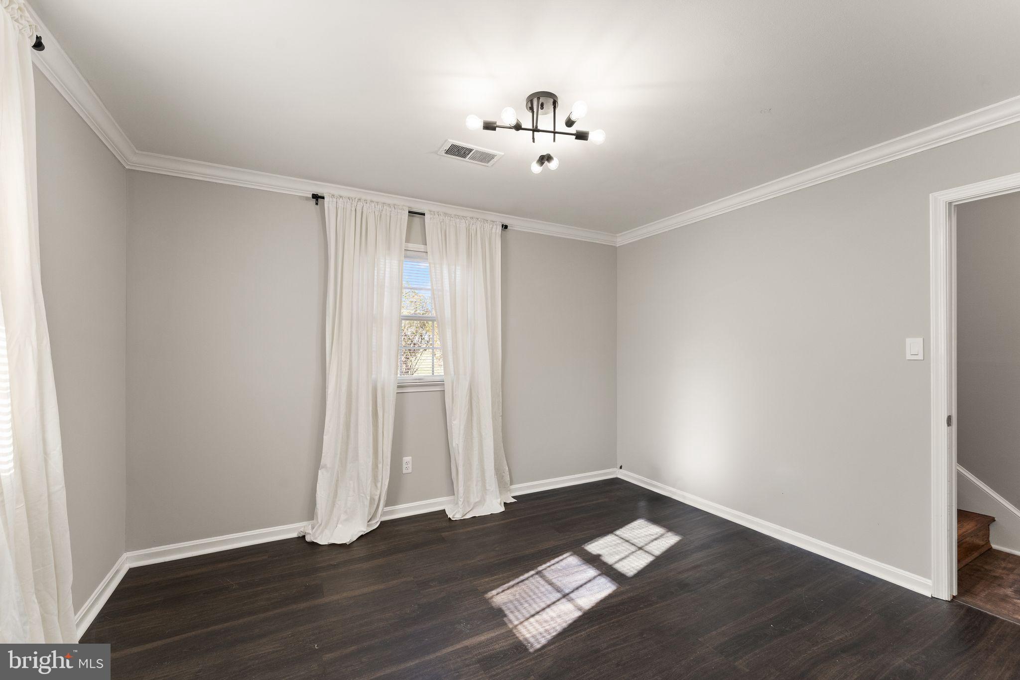 6101 Briarview Court Alexandria, VA 22310 - Photo 31 of 44 an empty room with wooden floor and window
