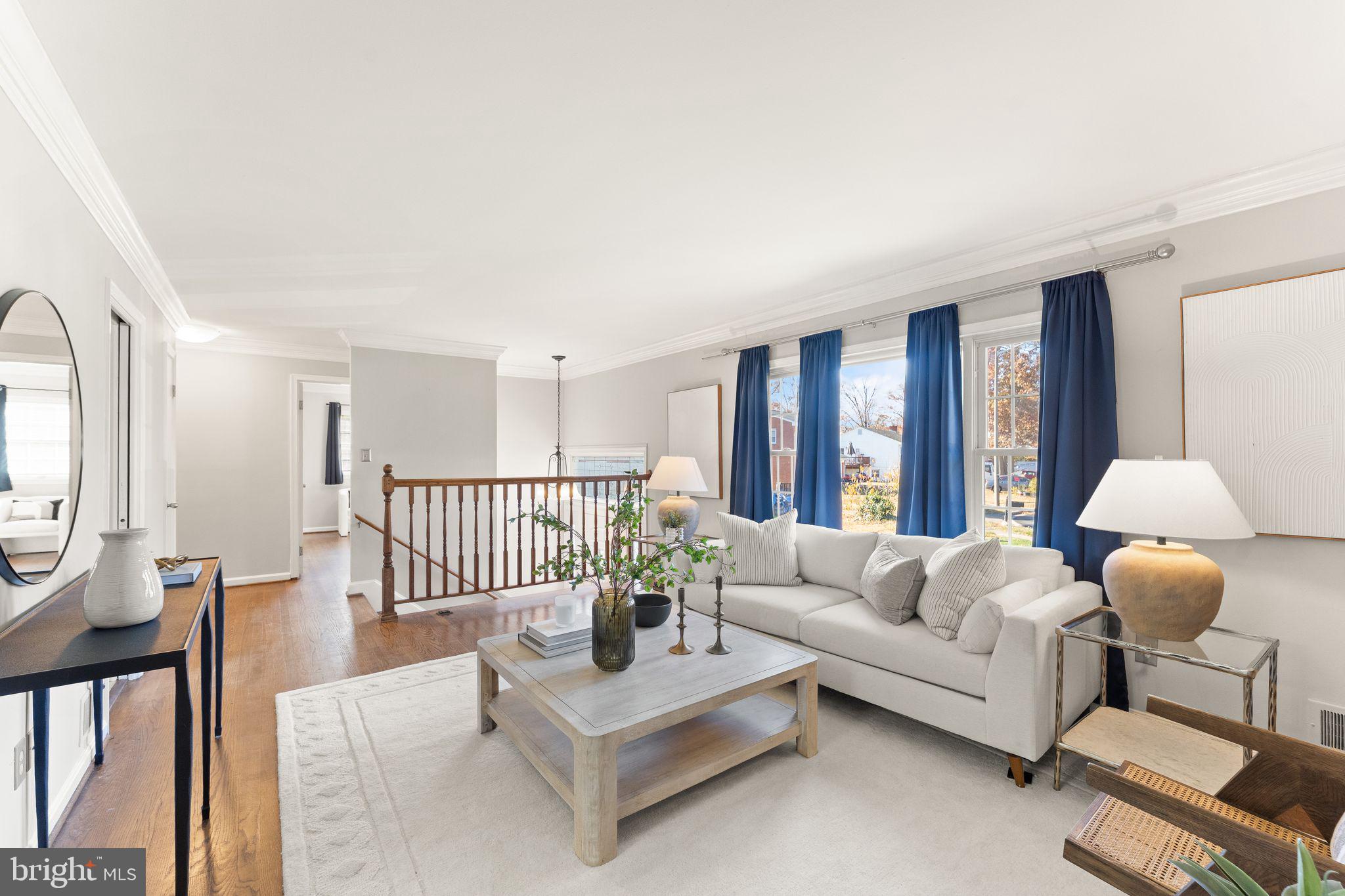 6101 Briarview Court Alexandria, VA 22310 - Photo 8 of 44 a living room with furniture and a lamp